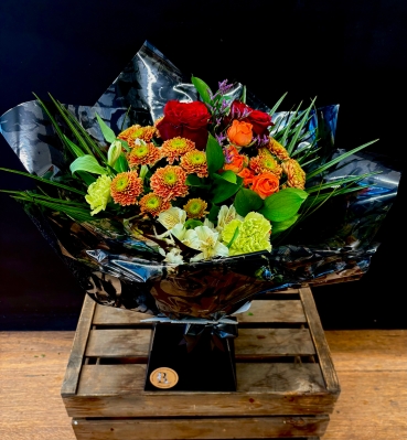 Mixed seasonal hand tied in water bouquet to include 2 red roses