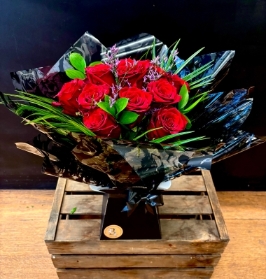 Luxury dozen red rose hand tied in water bouquet